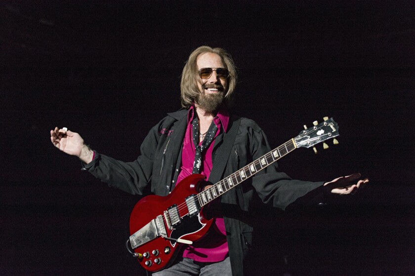 FILE - In a Sunday, Sept. 17, 2017, file photo, Tom Petty and the Heartbreakers perform at KAABOO 2017 at the Del Mar Racetrack and Fairgrounds, in San Diego. Nearly two decades after earning a place in the Rock and Roll Hall of Fame and more than four years after his death, rock icon Petty has been awarded an honorary Ph.D. from the University of Florida, the school’s board of trustees announced Friday, Dec. 3, 2021. (Photo by Amy Harris/Invision/AP, File)