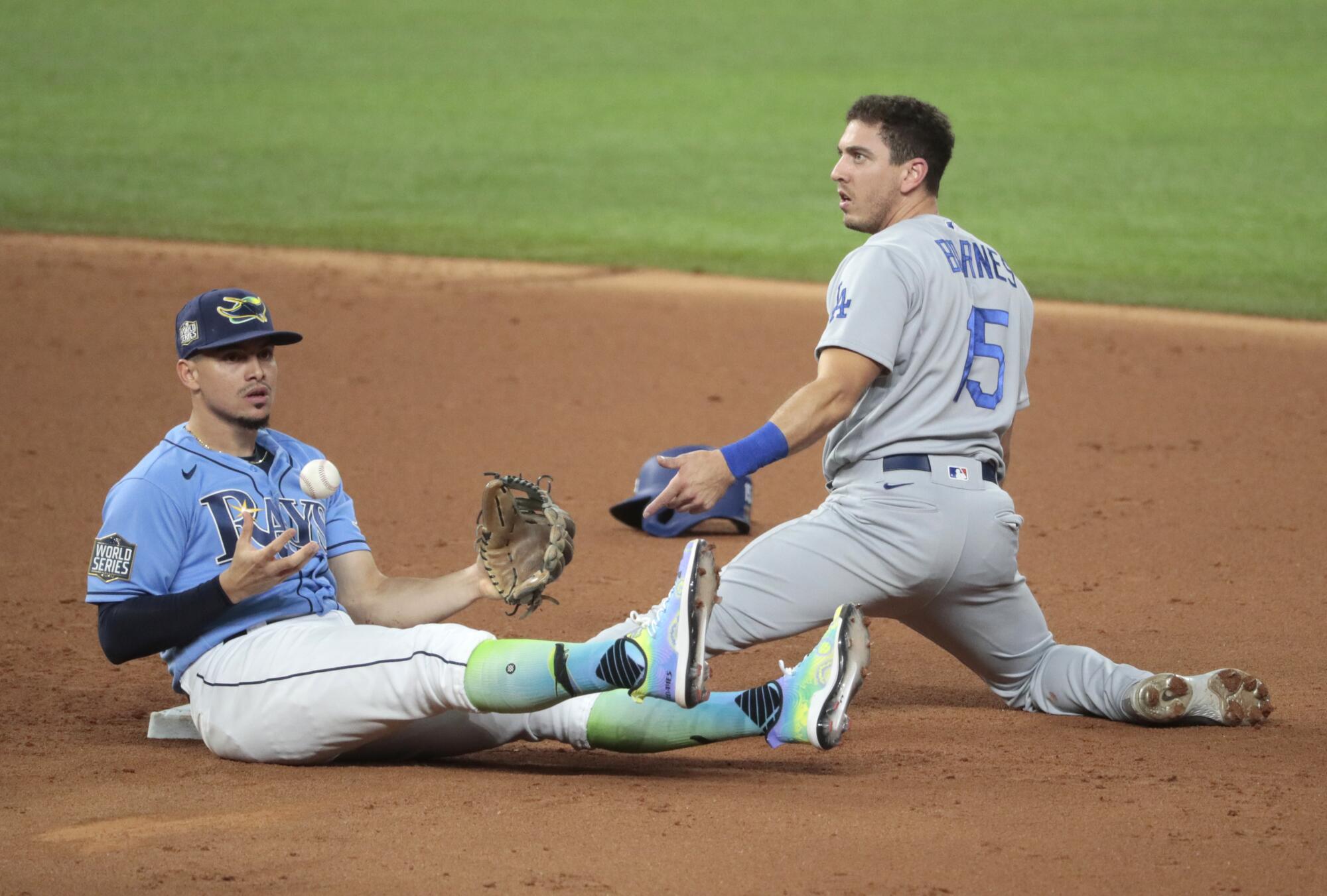 Dodgers catcher Austin Barnes is caught stealing after being tagged by Tampa Bay Rays shortstop Willy Adames.