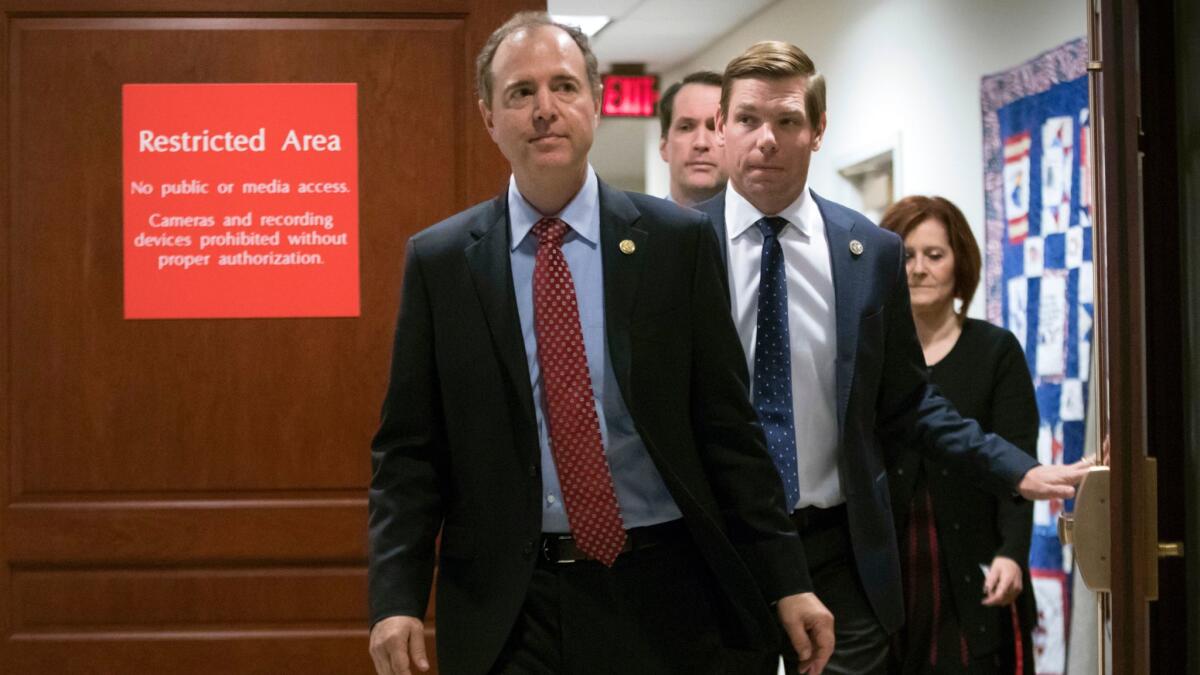 Rep. Adam Schiff, Rep. Eric Swalwell and Rep. Jim Himes, three Democratic members of the House Intelligence Committee, leave a secure briefing room earlier this month.