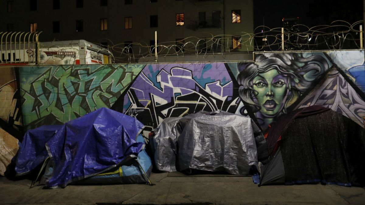 Tents line San Julian Street on skid row in the early morning.