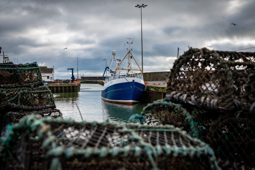 FILE- In this Tuesday, Jan. 28, 2020 file photo, a fishing vessel is docked at Kilkeel harbor in Northern Ireland. Fishing has become one of the main stumbling blocs in the Brexit negotiations for a new trade deal between the European Union and the United Kingdom. (AP Photo/David Keyton, File)