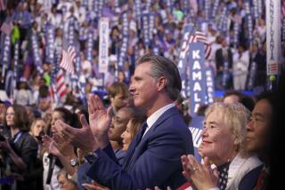 CHICAGO, IL AUGUST 22, 2024 - Gov. Gavin Newsom applauds Democratic presidential nominee Vice President Kamala Harris (not shown) during the Democratic National Convention Thursday, Aug. 22, 2024, in Chicago, IL. (Robert Gauthier/Los Angeles Times)