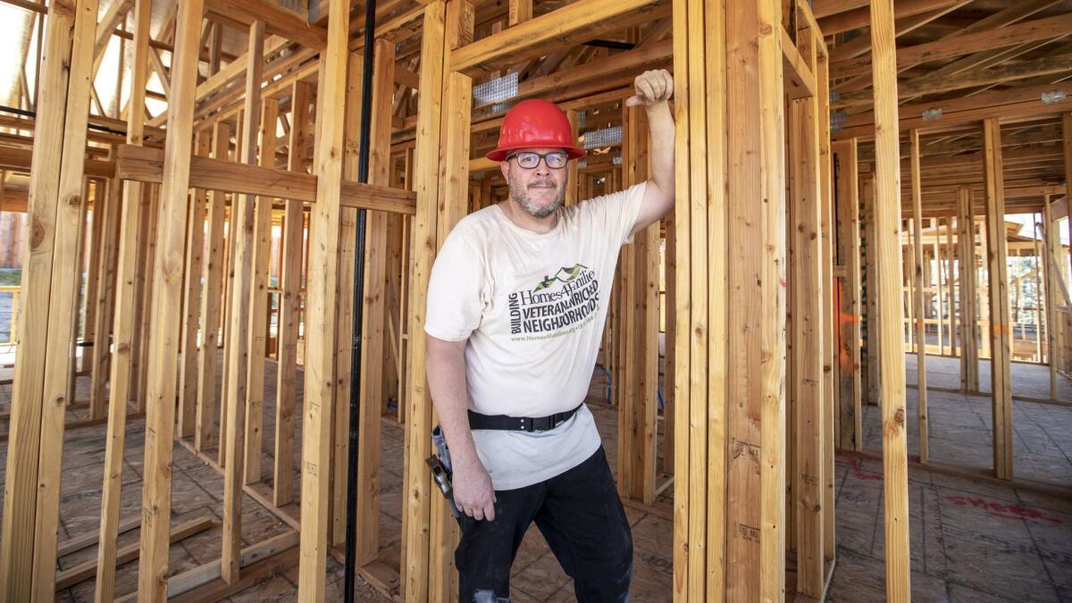 Army veteran Mark Johnson works to complete his sweat equity hours in the Homes 4 Families program by helping to build his own home as well as other homes in his community in Santa Clarita.