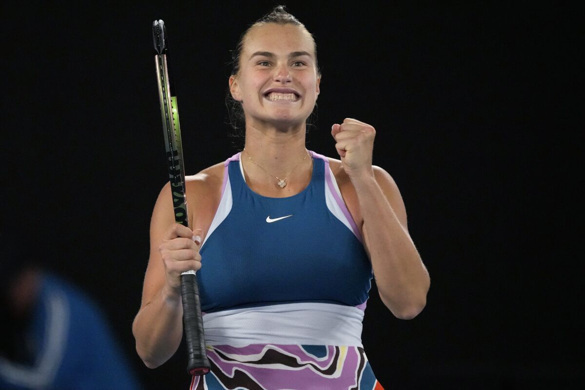 Aryna Sabalenka of Belarus celebrates after defeating Magda Linette of Poland during their semifinal match at the Australian Open tennis championship in Melbourne, Australia, Thursday, Jan. 26, 2023. (AP Photo/Aaron Favila)