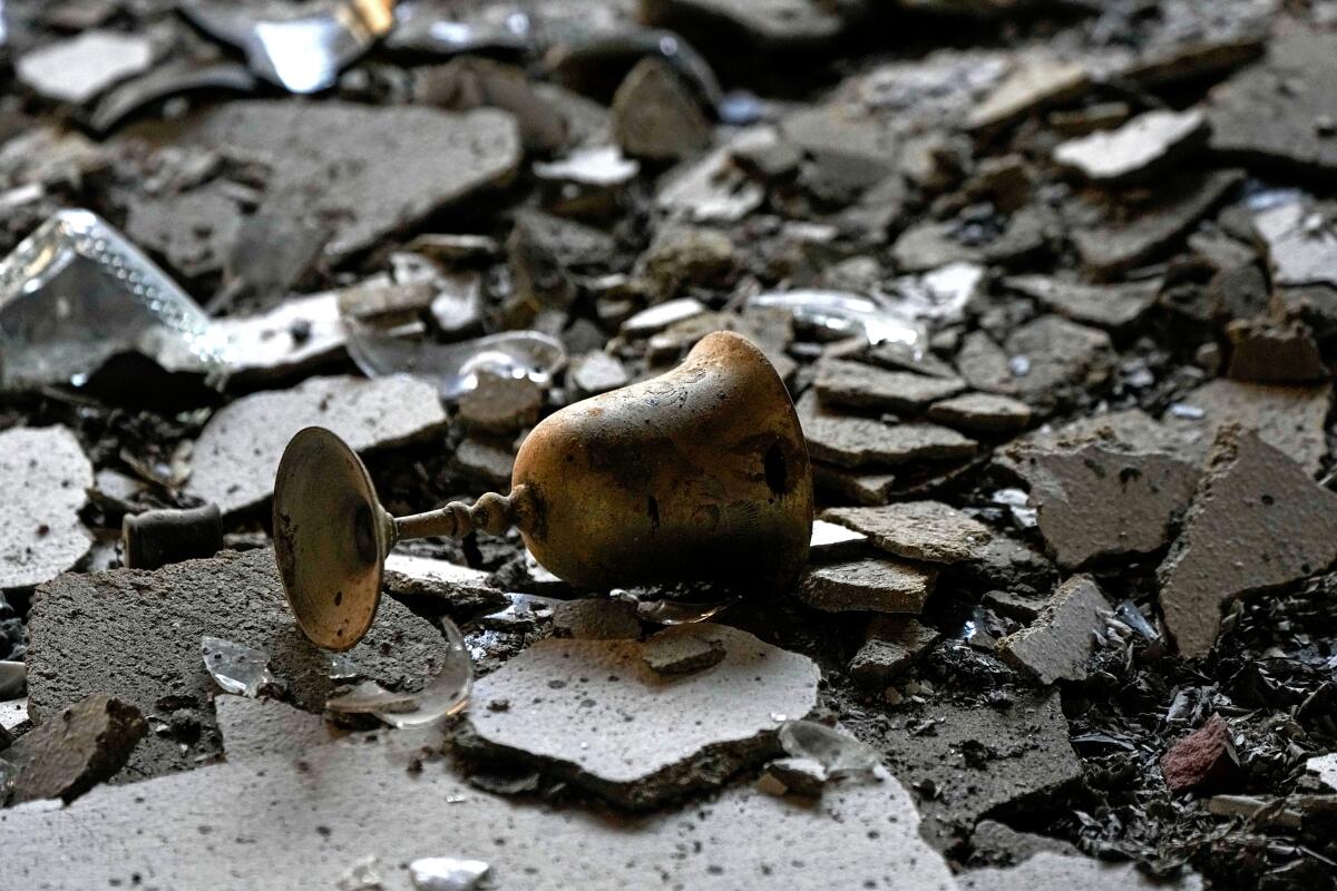 A burnt Kiddush cup in a house damaged by Hamas militants is seen in Kibbutz Be'eri, Israel, on Oct. 14