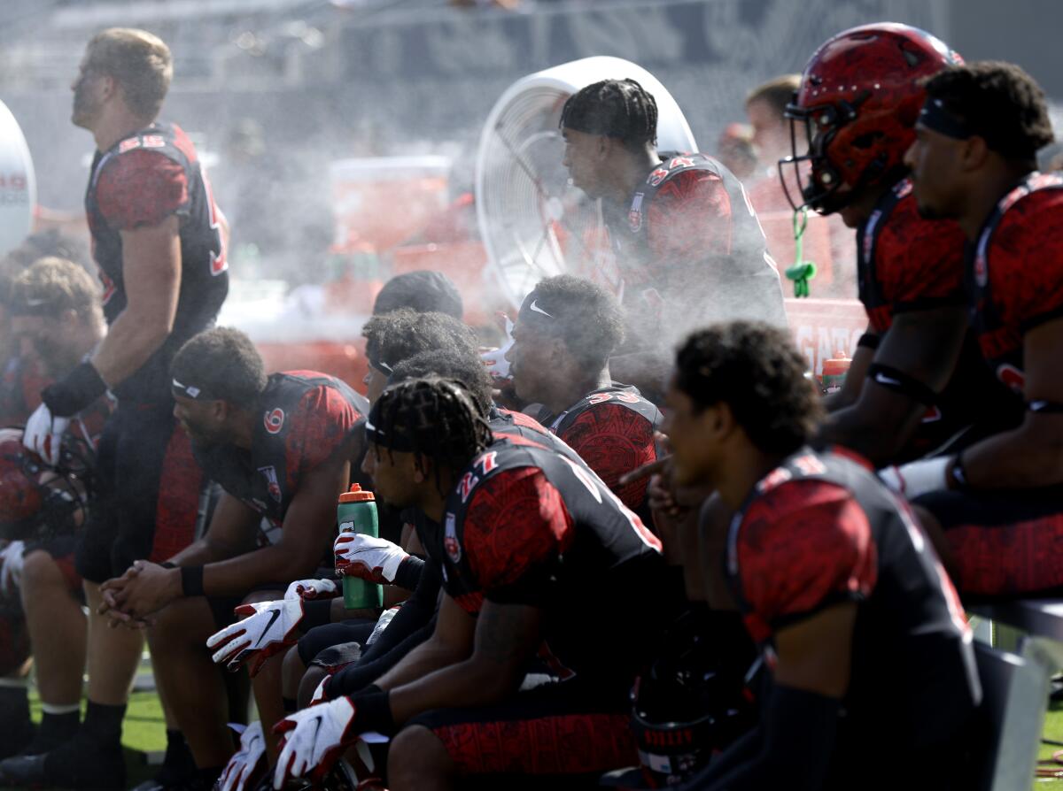 Misters were on the San Diego State and Arizona sidelines in effort to cool players on a record 100-degree day.