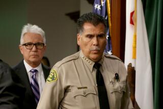 Los Angeles, CA - Los Angeles County District Attorney George Gascon, left, and Sheriff Robert Luna hold a news conference at the Hall of Justice in downtown L.A. on Wedensday, Sept. 20, 2023,t o announce charges against Kevin Cataneo Salazar, who is accused of gunning down Sheriff's Deputy Ryan Clinkunbroomer in Palmdale. (Luis Sinco / Los Angeles Times)