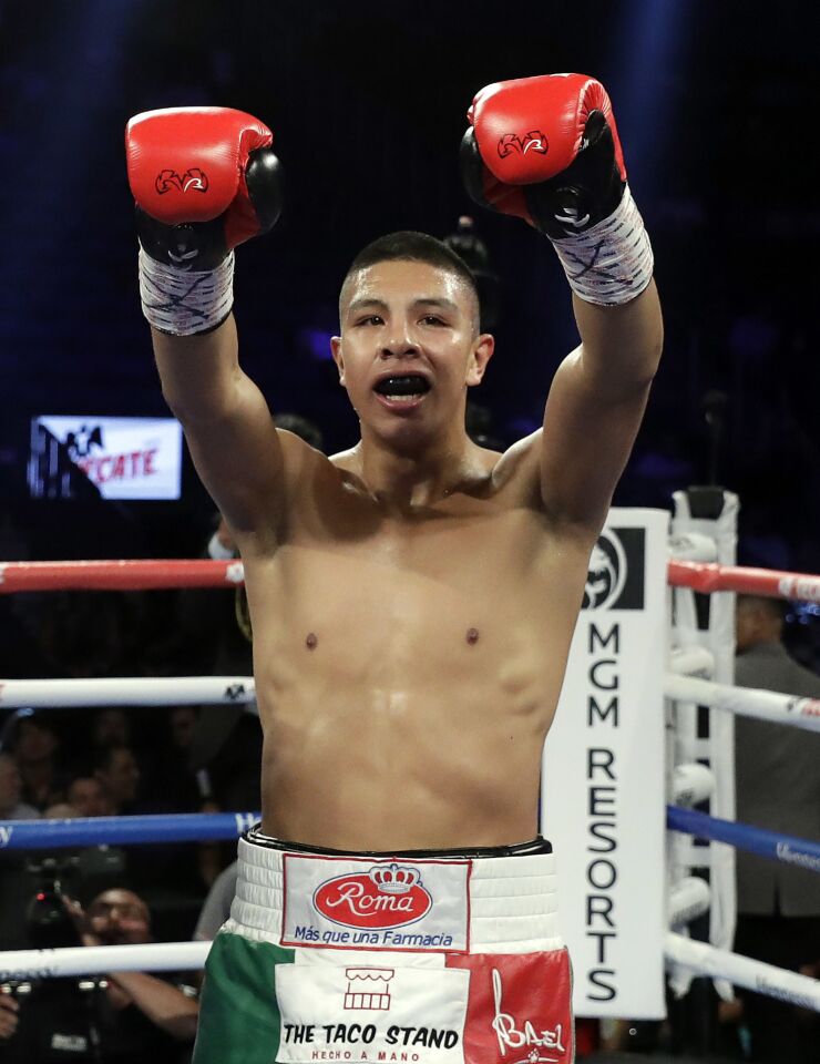 Jaime Munguia celebrates his third-round TKO victory over Brandon Cook following their WBO junior middleweight championship boxing match, Saturday, Sept. 15, 2018, in Las Vegas.