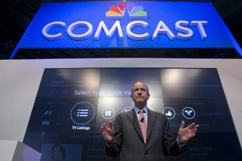 Brian Roberts, chairman and chief executive of Comcast Corp., speaks during a news conference at the National Cable and Telecommunications Assn. Cable Show in Washington, D.C., in June 2013.