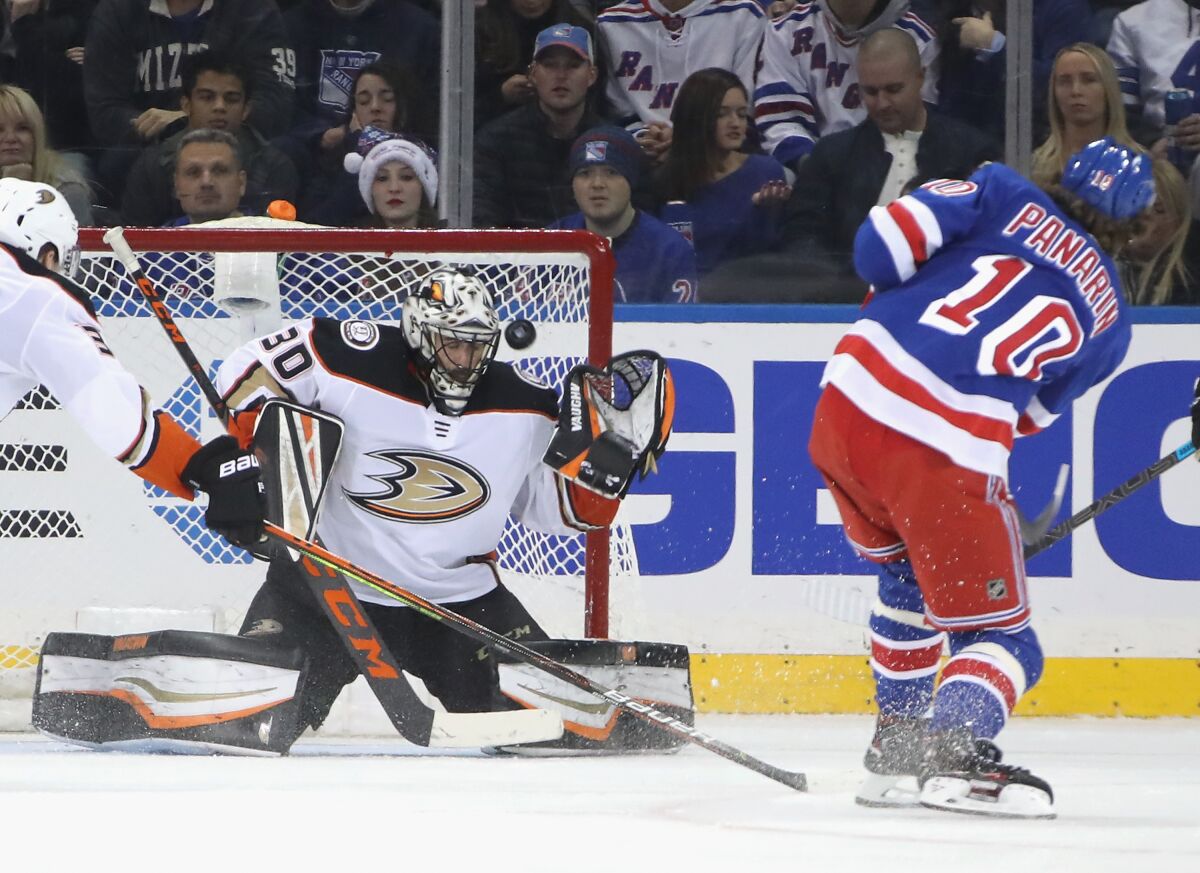 Ducks goaltender Ryan Miller stops a shot by New York Rangers forward Artemi Panarin.