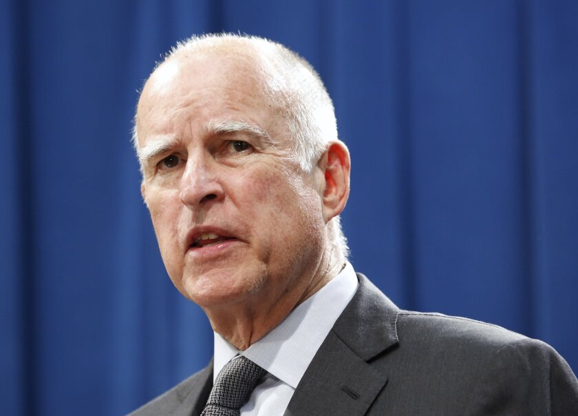 Gov. Jerry Brown answers a question concerning the budget agreement reached with legislative leaders at a Capitol news conference in Sacramento on June 16.
