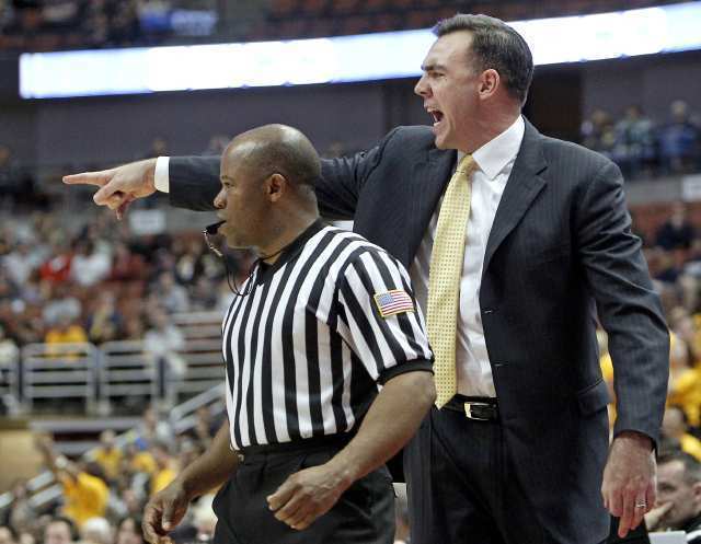 UC Irvine head coach Russell Turner, right, during the second half against Long Beach State in a Big West Basketball Tournament semifinal game Friday at Honda Center.