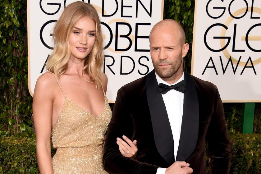 Supermodel Rosie Huntington-Whiteley and actor Jason Statham attend the 73rd Golden Globe Awards at the Beverly Hilton Hotel on Sunday.