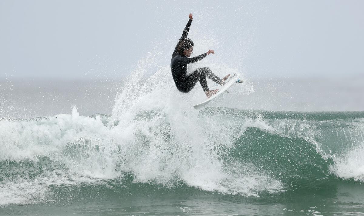 Toby Dussault, 17, surfs at Seaside Reef at Cardiff State Beach on June 30. 