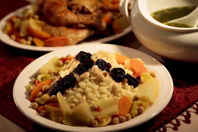 Quick coucous with dried fruit and almond garnish with seven blessed vegetables and chicken. Recipe