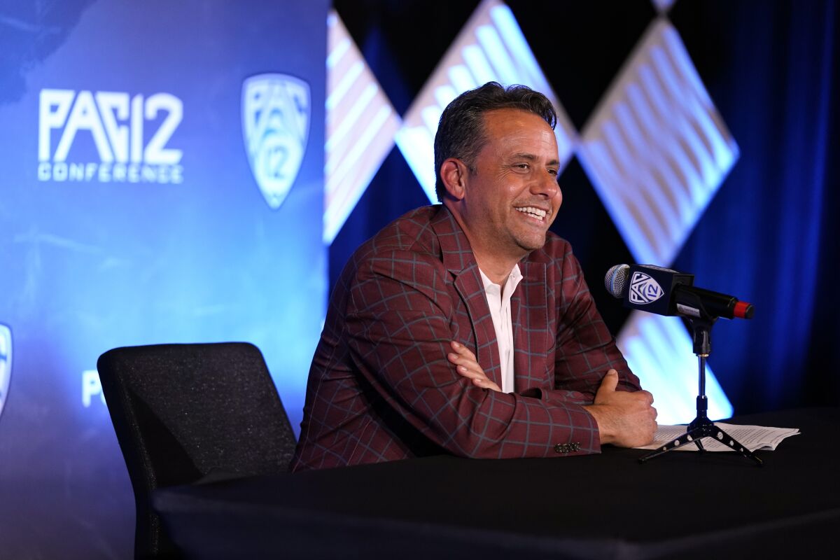 Arizona head coach Jedd Fisch answers questions during the Pac-12's football Media Day in Los Angeles.
