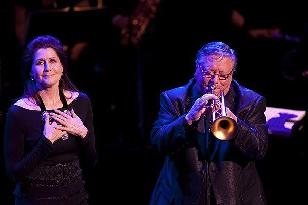 Singer Monica Mancini reflects for a moment as trumpeter Arturo Sandoval accompanies her on the song "Moon River," which her father, Henry Mancini, wrote.