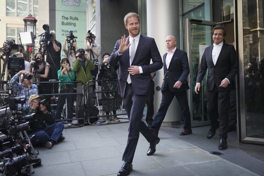 Prince Harry leaves the High Court after giving evidence in London, Wednesday, June 7, 2023. Prince Harry has given evidence from the witness box and has sworn to tell the truth in testimony against a tabloid publisher he accuses of phone hacking and other unlawful snooping. He alleges that journalists at the Daily Mirror and its sister papers used unlawful techniques on an "industrial scale" to get scoops. Publisher Mirror Group Newspapers is contesting the claims. (AP Photo/Kin Cheung)