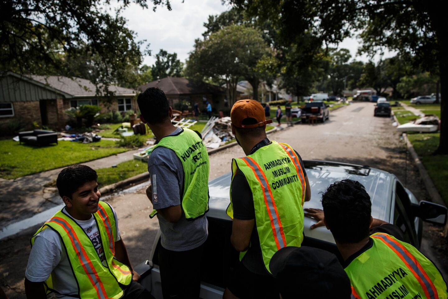 Volunteers from the Ahmadiyya Muslim Youth Association help residents of the Westbury neighborhood in Houston clear debris from their homes. It is also the Islamic holiday of Eid-ul-Adha. (Marcus Yam / Los Angeles Times)