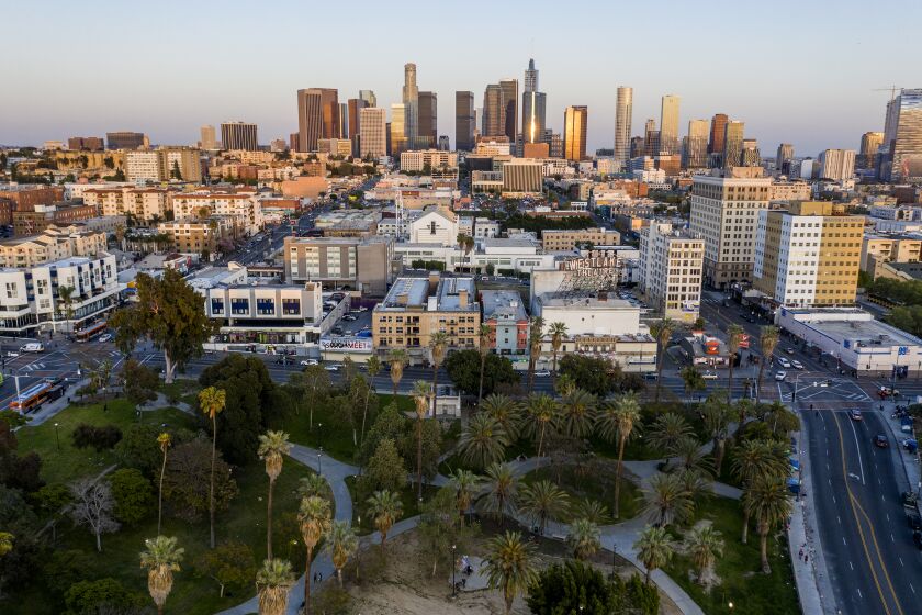 Los Angeles, CA, TUESDAY, APRIL 21 - Downtown shines in the setting sun looking East from MacArthur Park during the Coronavirus pandemic. (Robert Gauthier / Los Angeles Times)
