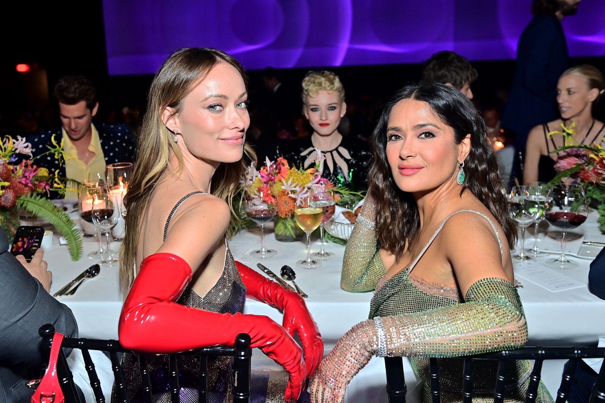 Olivia Wilde, Julia Garner, and Salma Hayek in formalwear