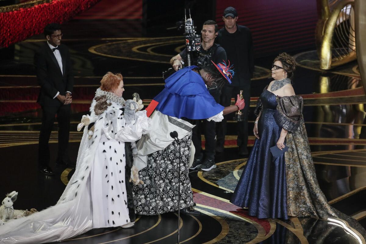 Melissa McCarthy and Brian Tyree Henry present the Oscar for custom design to Ruth E. Carter for "Black Panther" during the telecast of the 91st Academy Awards.