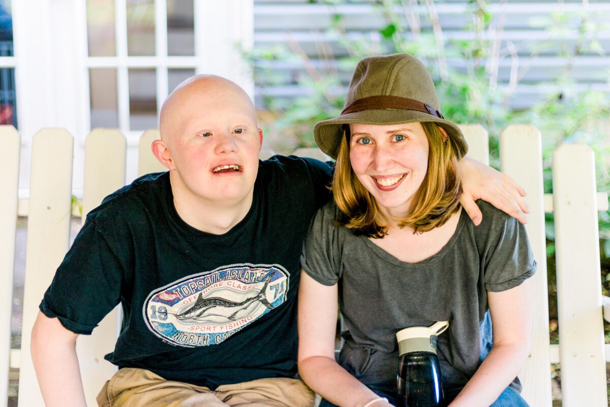 Anna Moyer, founder of Accessible Chef, sitting with her brother Sam.