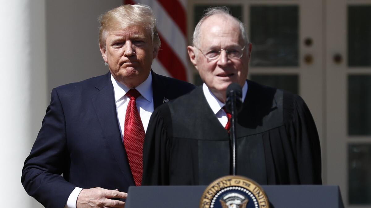 President Donald Trump, left, and Supreme Court Justice Anthony Kennedy participate in a public swearing-in ceremony for Justice Neil Gorsuch on June 27, 2017.