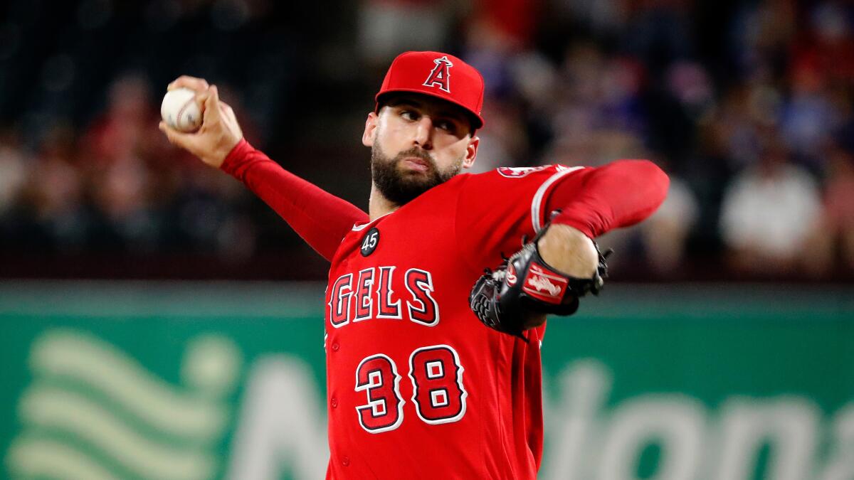 Angels relief pitcher Justin Anderson throws to the Texas Rangers.