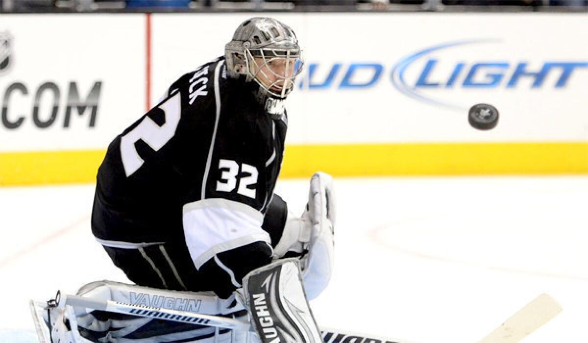 Jonathan Quick deflects a San Jose shot during the Kings' 3-0 victory over the Sharks in Game 5 of their playoff series Thursday.
