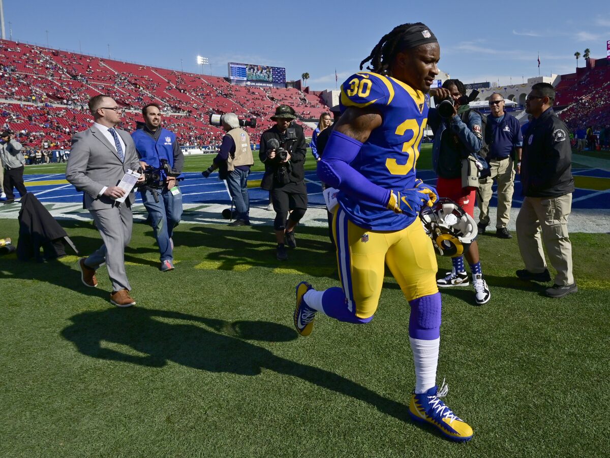 Todd Gurley runs off the field following the Rams' season finale against the Cardinals on Dec. 29. 2019, at the Coliseum.