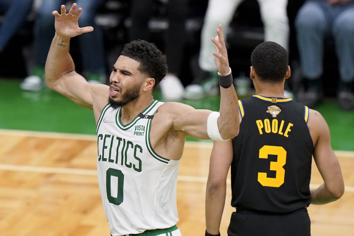 The Boston Celtics' Jayson Tatum reacts to a fourth-quarter play June 10, 2022, in Boston.