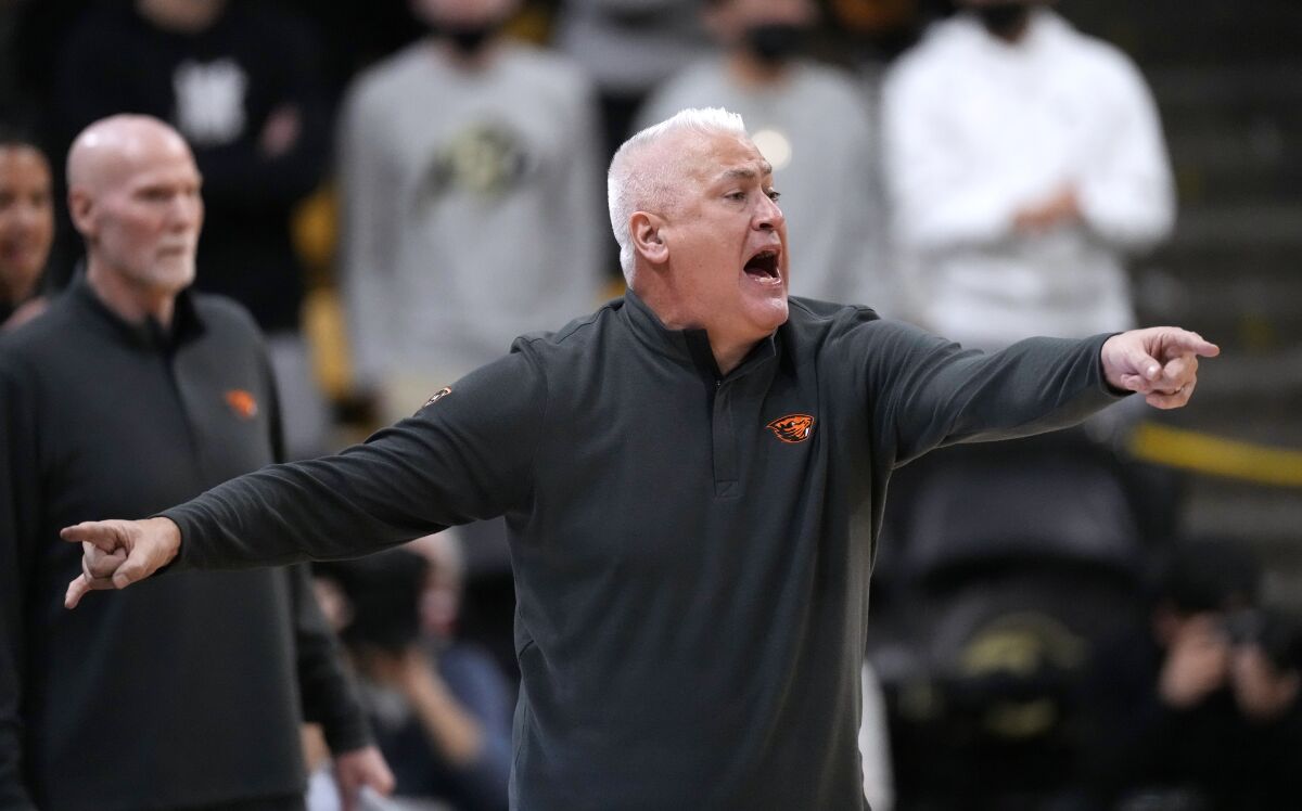 Oregon State coach Wayne Tinkle gestures during the first half of the team's NCAA college basketball game against Colorado on Saturday, Feb. 5, 2022, in Boulder, Colo. (AP Photo/David Zalubowski)
