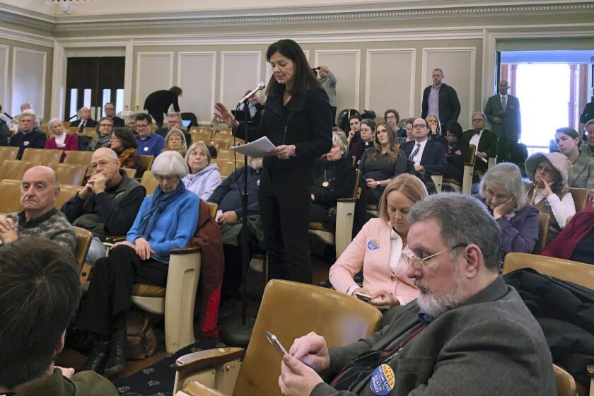 Former U.S. Sen. Kelly Ayotte testifies Tuesday, Feb. 19, 2019, in Concord, N.H., against a bill that would repeal New Hampshire's death penalty. Ayotte, a former attorney general, was the lead prosecutor in the capital murder case of Michael Addison, the state's only death row inmate, who killed a Manchester police officer in 2006. (AP Photo/Holly Ramer)