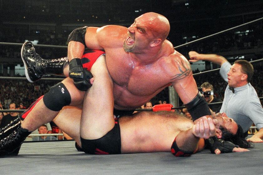 World Championship Wrestling heavyweight Bill Goldberg puts Scott Hall to the mat during a WCW match July 6, 1998 in Atlanta.