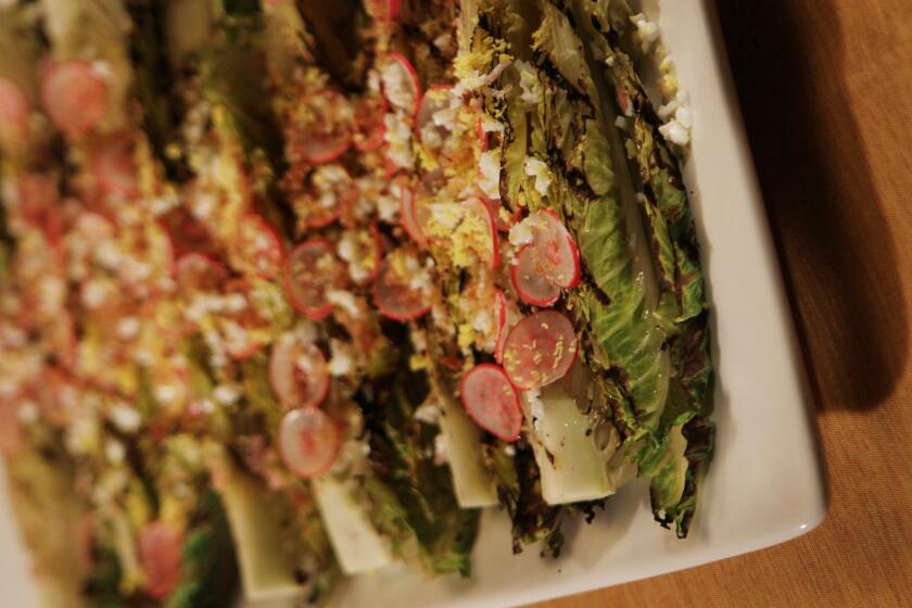 Try a grilled salad with this recipe for grilled romaine with toasted bread crumbs and radish.