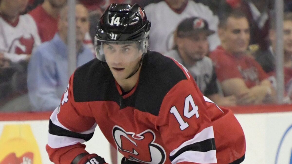 The Ducks acquired center Adam Henrique in a trade with New Jersey on Thursday.