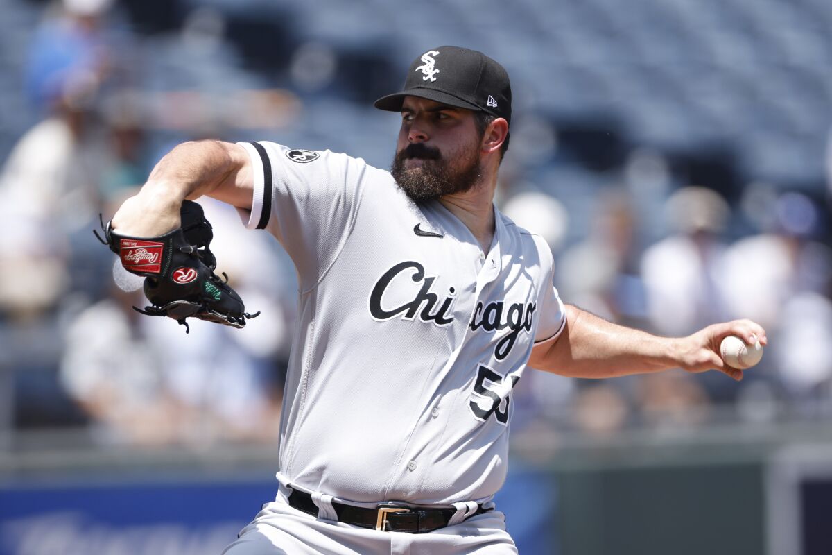 Chicago White Sox pitcher Carlos Rodon delivers to a Kansas City Royals batter during the first inning of a baseball game at Kauffman Stadium in Kansas City, Mo., Thursday, July 29, 2021. (AP Photo/Colin E. Braley)