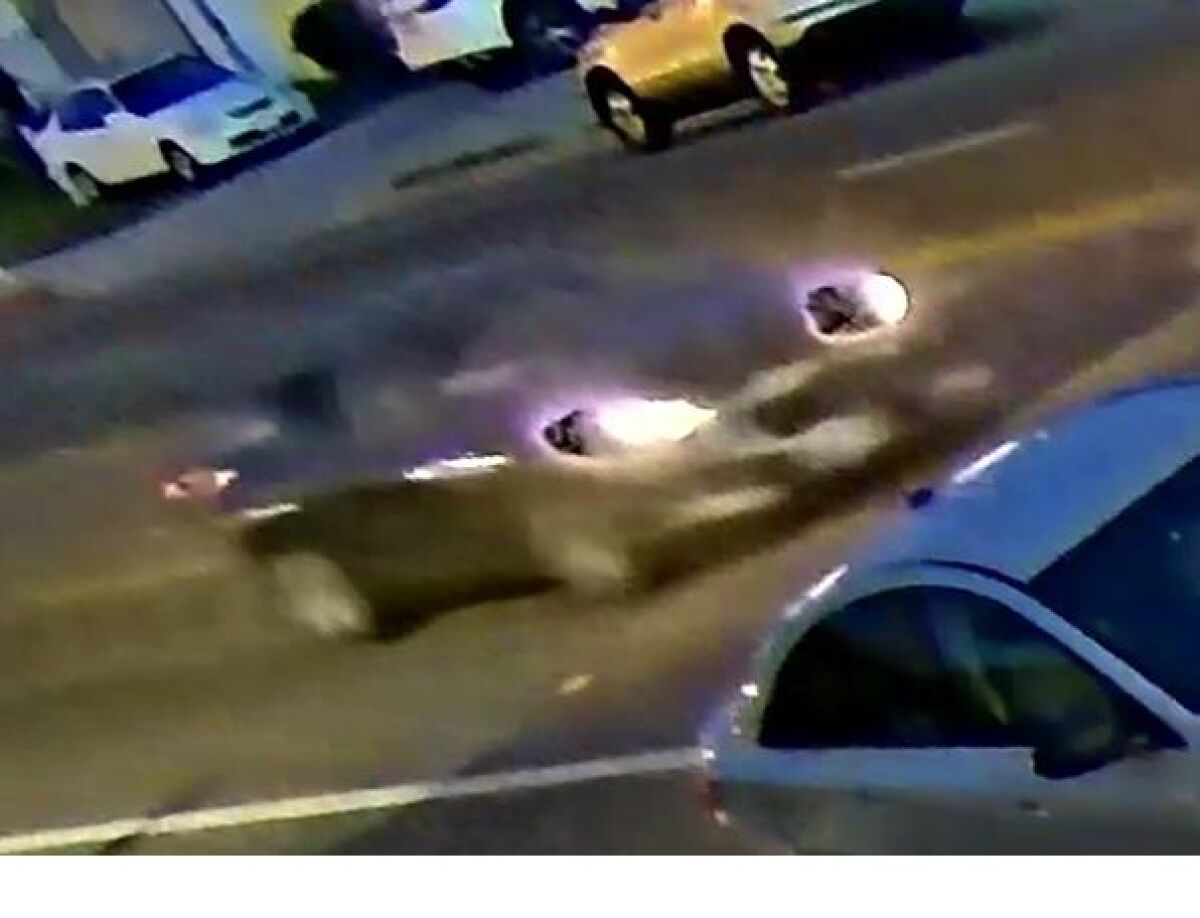 surveillance image of car driving on street