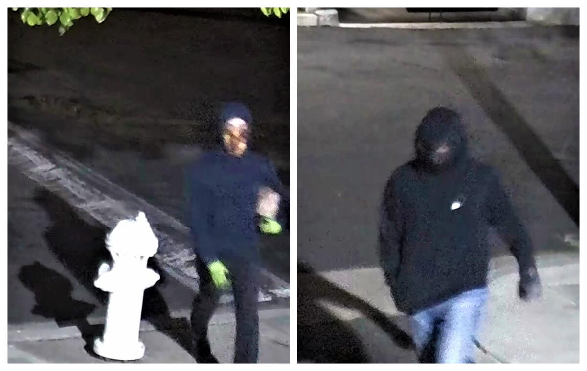 Two suspects seen on video March 13, 2022, were wanted by the FBI for allegedly tossing a Molotov cocktail at health center. 