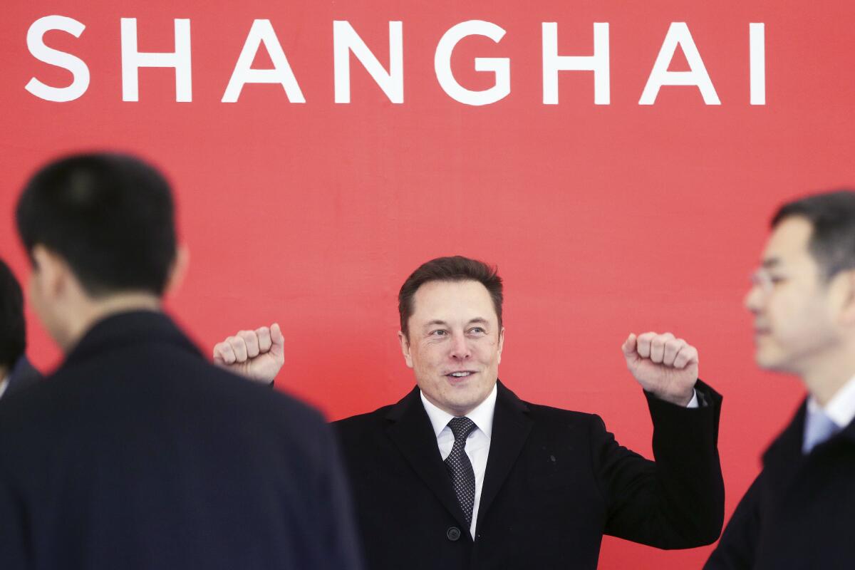 FILE - In this photo released by Xinhua News Agency, Tesla CEO Elon Musk attends the groundbreaking ceremony of the Tesla Shanghai factory in Shanghai, China on Jan. 7, 2019. Musk’s ties to China through his role as electric car brand Tesla’s biggest shareholder could add complexity to his bid to buy Twitter. (Ding Ting/Xinhua via AP, File)