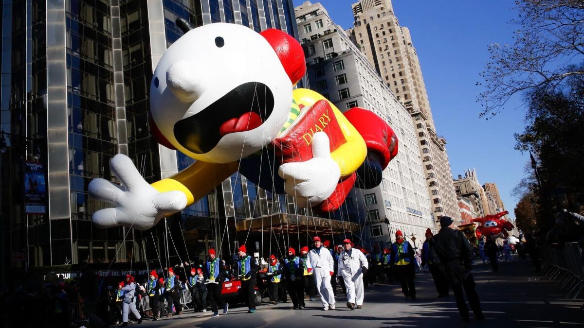 A balloon of Greg Heffley from "Diary of a Wimpy Kid" floats down Central Park West during the Macy's Thanksgiving Day Parade in New York on Thursday.