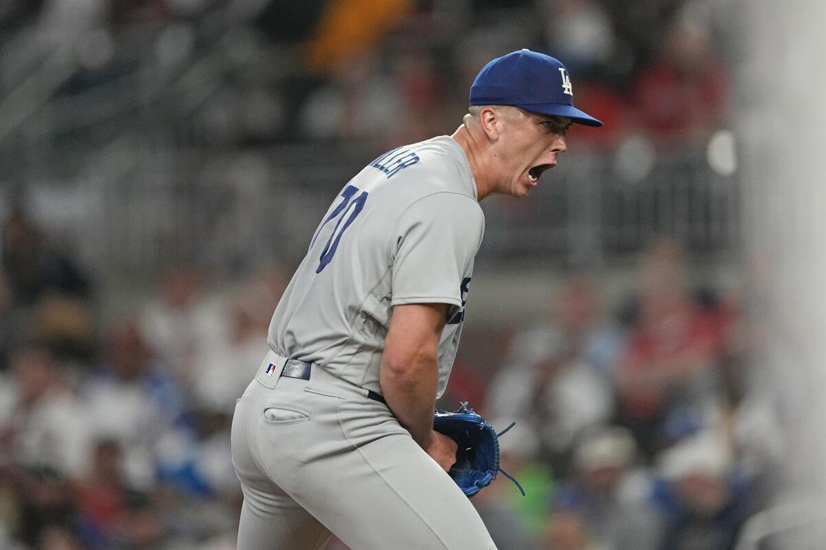 Dodgers' Bobby Miller reacts after recording the final out in the fifth inning against the Atlanta Braves on May 23, 2023.
