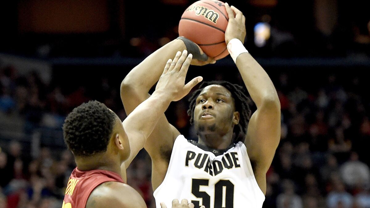 Purdue forward Caleb Swanigan pulls up for a shot over Iowa State guard Deonte Burton during the second half Saturday.