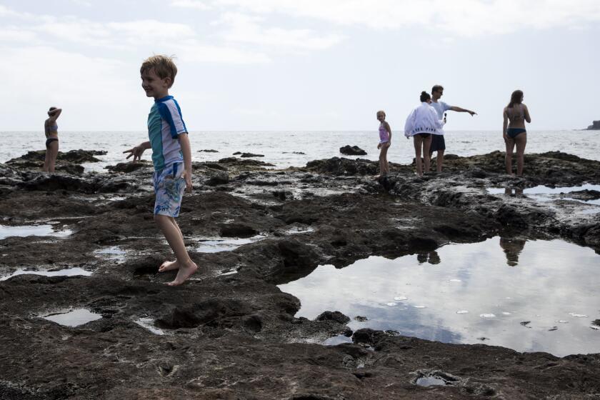 People at the tidepools at Hulopoe Bay on the Hawaiian island of Lanai in Lanai City.