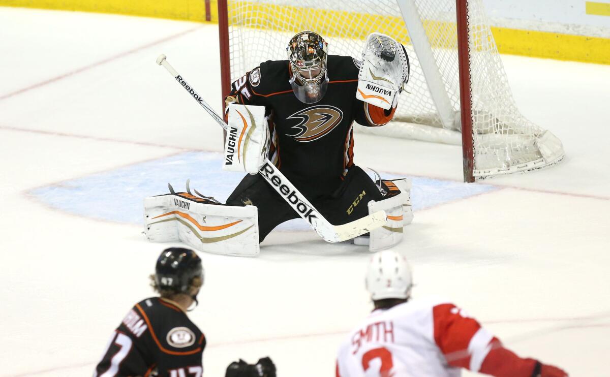 Ducks goalie John Gibson makes a glove save against the Detroit Red Wings at Honda Center on Feb. 23.