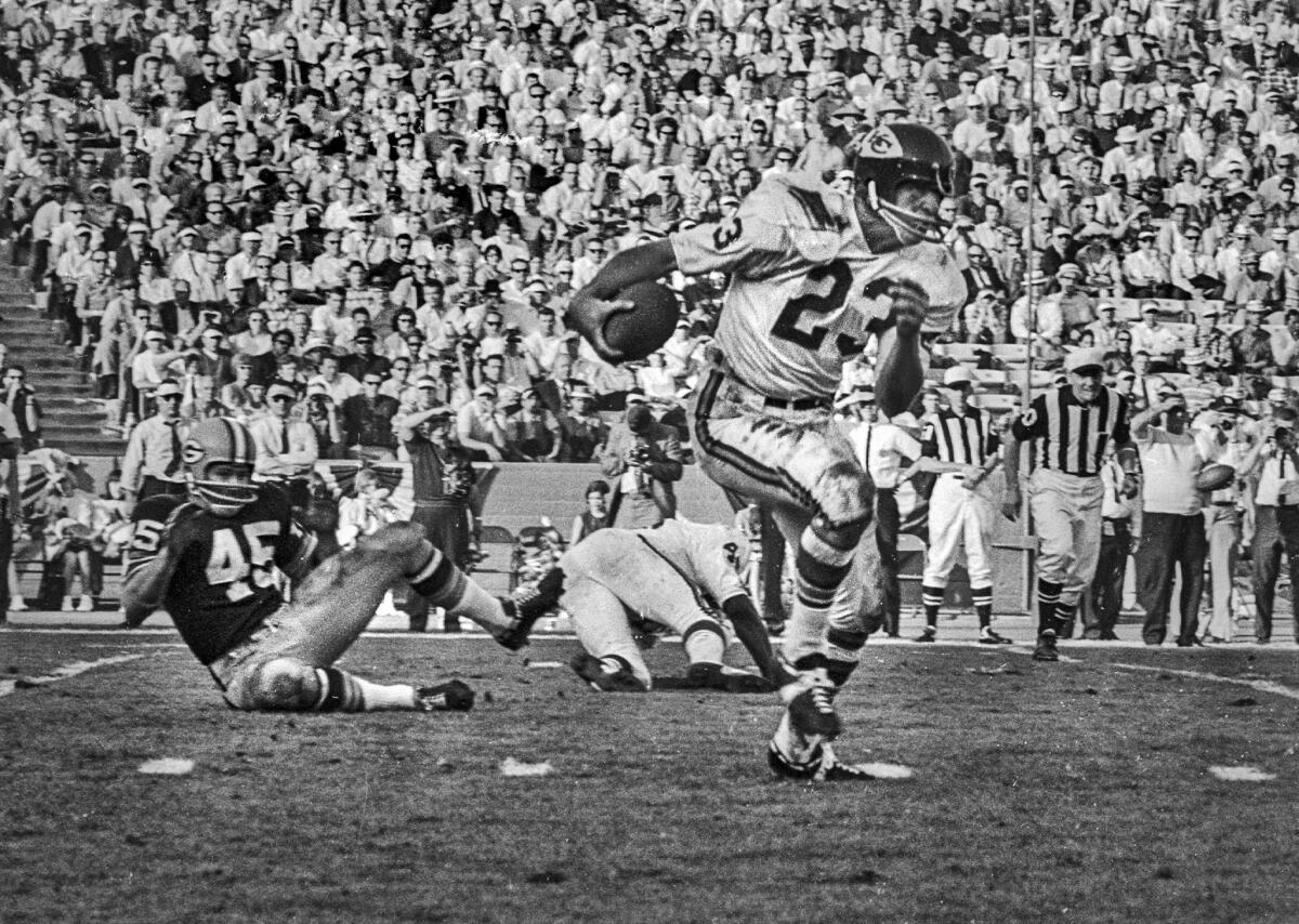 Jan. 15, 1967: Kansas City Chiefs halfback Bert Coann in action against the Green Bay Packers in first Super Bowl. Packers' Dave Hathcock is on left.