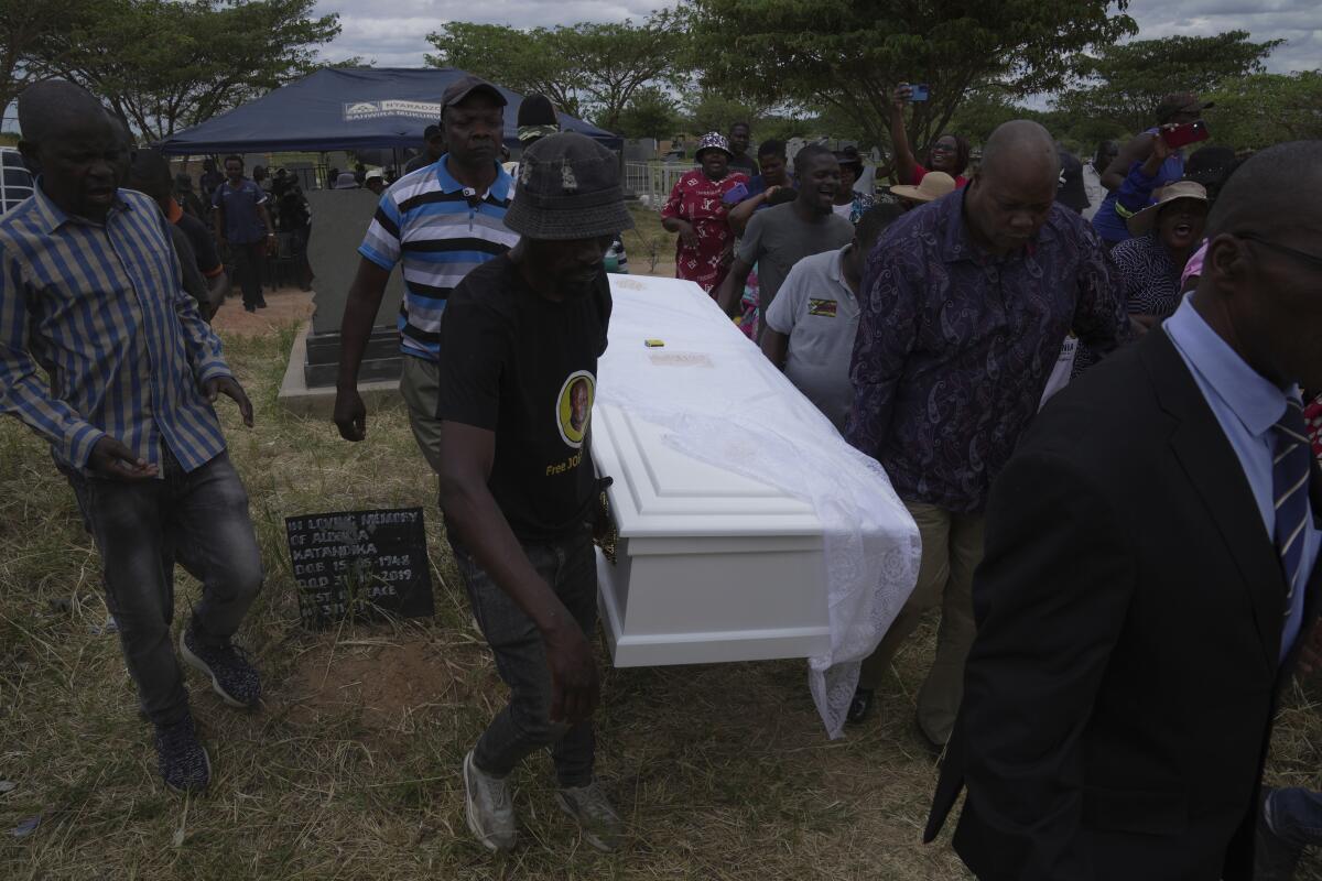 At the funeral of a slain Zimbabwean activist, clashes and a low turnout  mirror opposition decline - The San Diego Union-Tribune