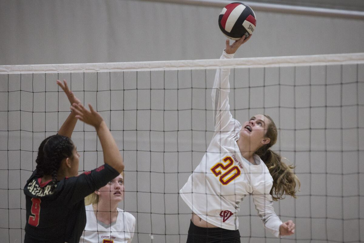 Ocean View's Emma Santy taps the ball over the net during a Golden West League match against Segerstrom in October 2019. 