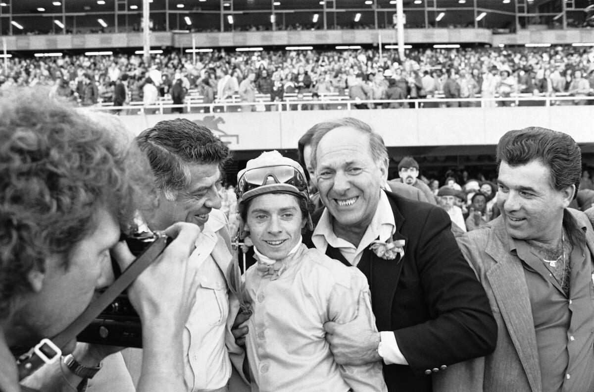 Television star Jack Klugman, right, hugs jockey Chris McCarron after the 1980 California Derby at Golden Gate Fields.